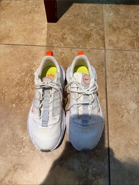 Nike Kids White Sneakers with Neon Orange and Yellow Accents